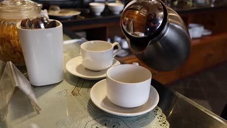 coffee being poured into a cup