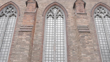 gothic church windows on brick wall