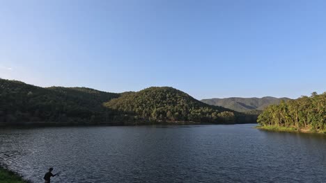 time-lapse of a lake from day to dusk