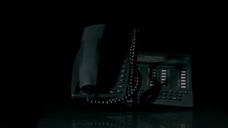 telephone falling on black background