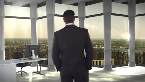 Rear-view-of-businessman-standing-in-office