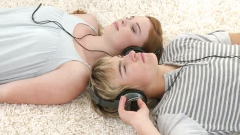 teenage couple listening to music