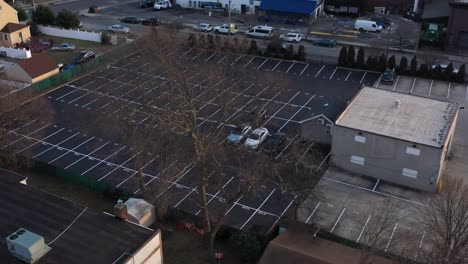 An-aerial-view-of-a-car-dealer-storage-lot-at-sunset