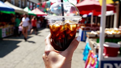 iced coffee at a bustling outdoor market