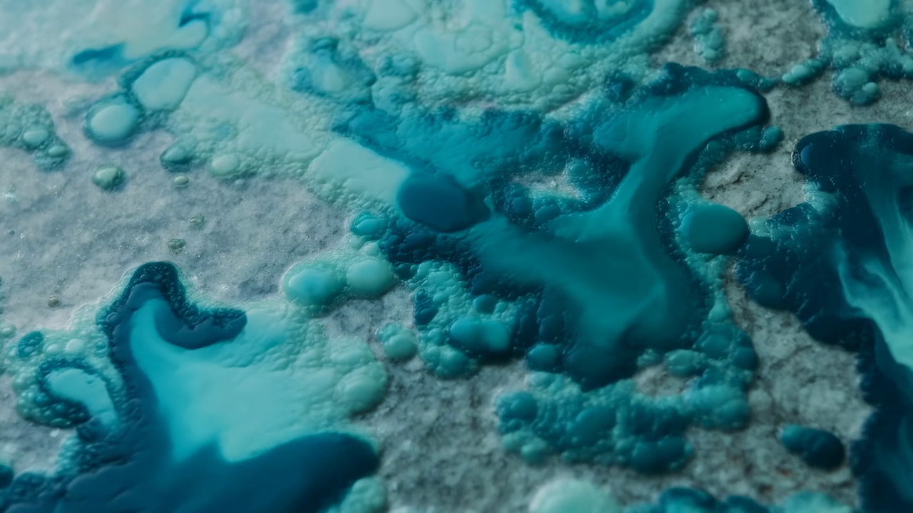 Teal Paint Flowing On Textured Canvas, Macro Shot Of Liquid Pigments Pooling And Spreading Across Rough White