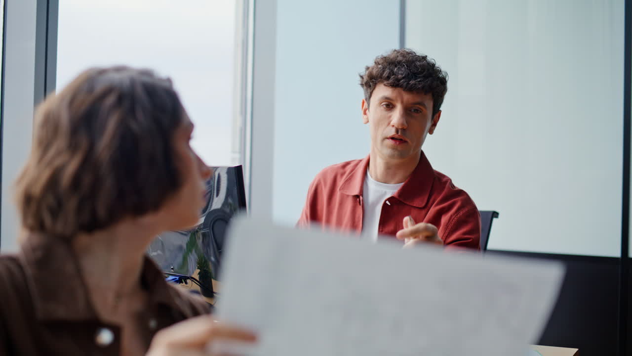 Woman checking documents colleague office closeup. Coworkers discussing report