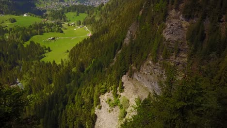 beautiful swiss green valley then revelation of a vertical fall in the mountain