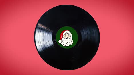 bucle de disco de vinilo con santa claus en el medio del disco aislado en fondo rojo