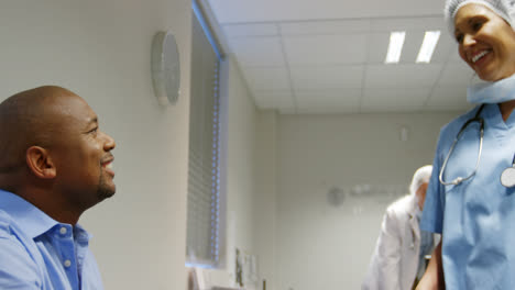 Female-doctor-shaking-hands-with-patient