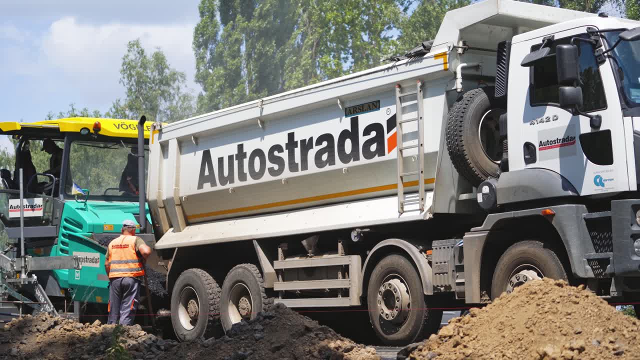 Construction and repair of highway. Road construction works with machine