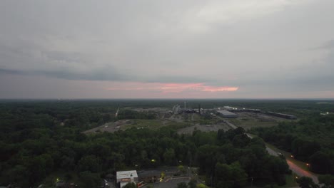 Aerial-drone-shot-over-old-large-woodworking-factory-top-view-during-evening-time