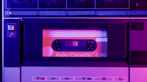 vintage audio cassette in a retro cassette player