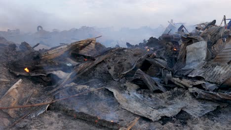 smoke rising from the remains of a recently flattened building in war-torn gaza