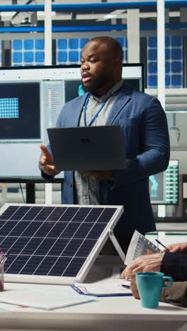 vertical video portrait of smiling photovoltaics factory researchers