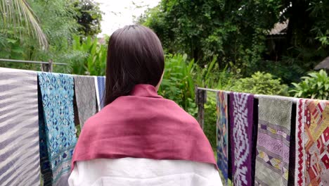 Woman Walking in a Garden with Traditional Clothes