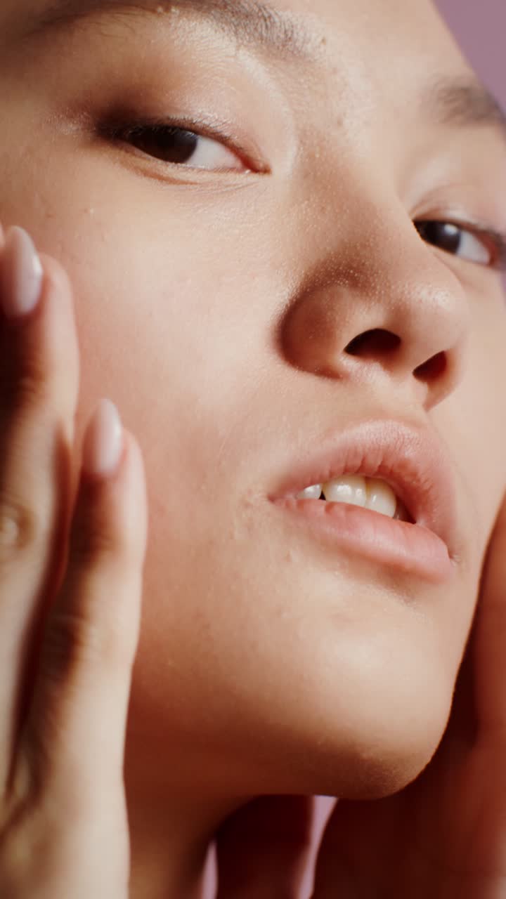 Close-up portrait of a woman's face and hands