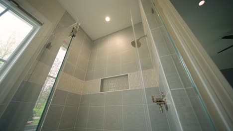 push in shot of the interior of a shower in a luxury bathroom