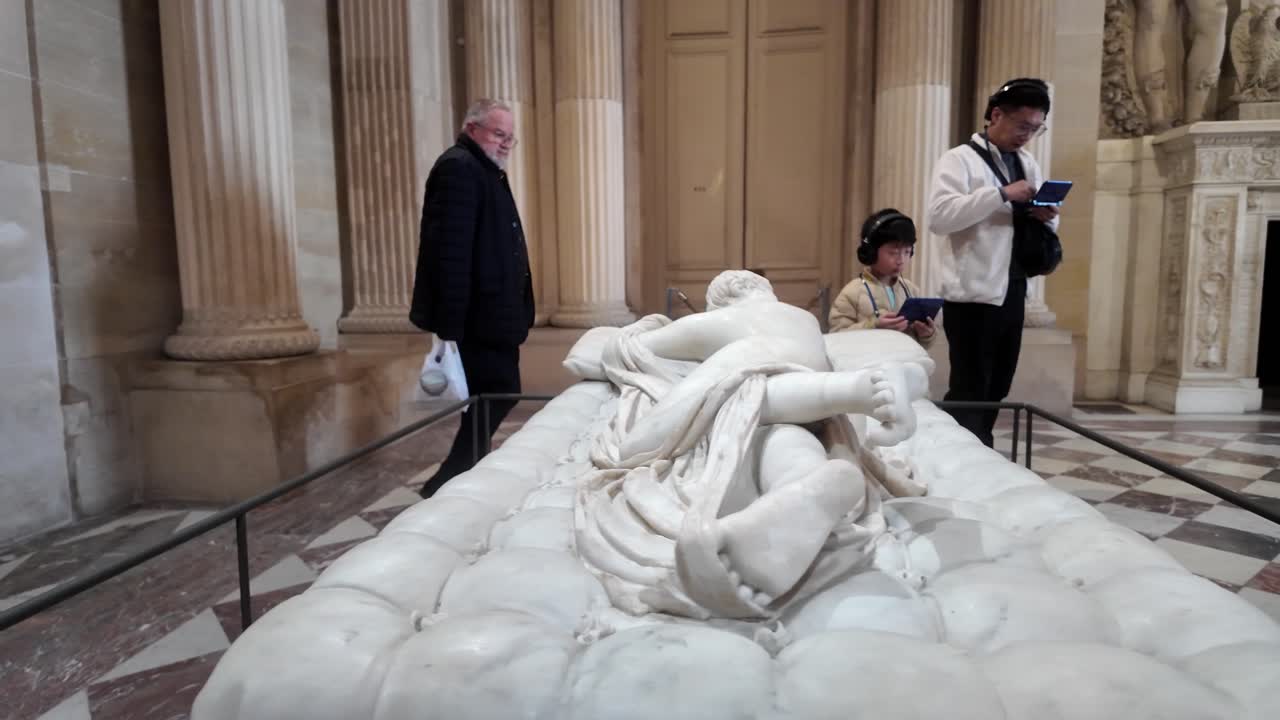 Marble Sculpture in Museum with Visitors