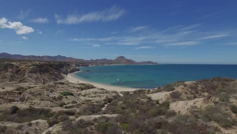 Aerial-shot-a-boat-in-a-bay-of-Cabo-Pulmo-National-Park,-Baja-California-Sur