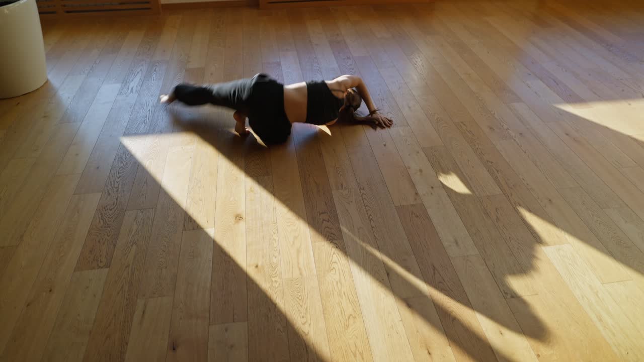 Woman Dancing on Wooden Floor