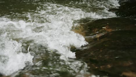 medium wide shot of a river with spray in a city