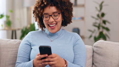 Funny,-phone-and-smile-with-woman-on-sofa