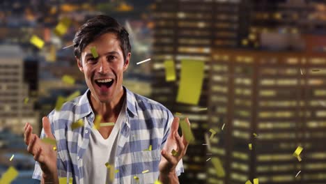 Animation-of-confetti-over-happy-caucasian-man-over-skyscrapers