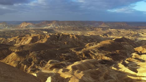 Man-Hiking-to-Mountain-Peak-Revealing-Beautiful-Negev-Desert-Landscape