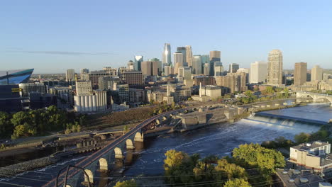 summer aerial of downtown minneapolis with stone arch bridge and falls