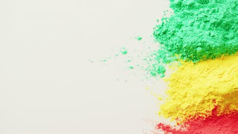 video of multi coloured powders with copy space on white background