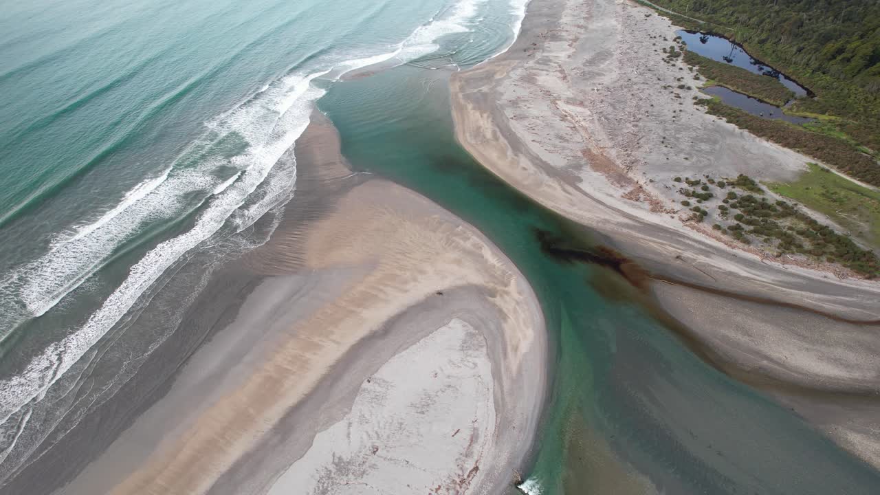 Creek Water Flowing To The Sea By Maori Beach In Bruce Bay, West Coast, South Island, New Zealand. - aerial shot