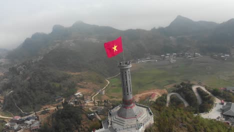 Orbit-of-Lung-Cu-Flag-pole-most-Northern-Point-Of-Vietnam,-aerial