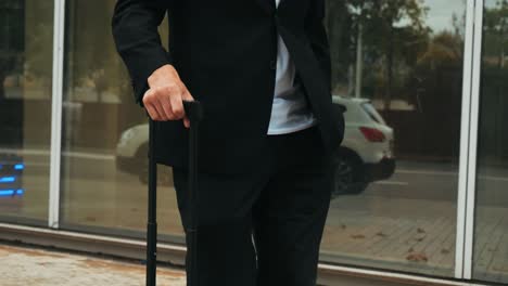 Tourist man with suitcase baggage in spain, A traveler with luggage suit jacket on business street go to a hotel, business office, airport terminal, enjoying the vibrant atmosphere