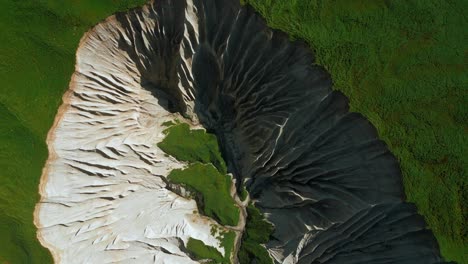 aerial view of a canyon with whitish and gray formations