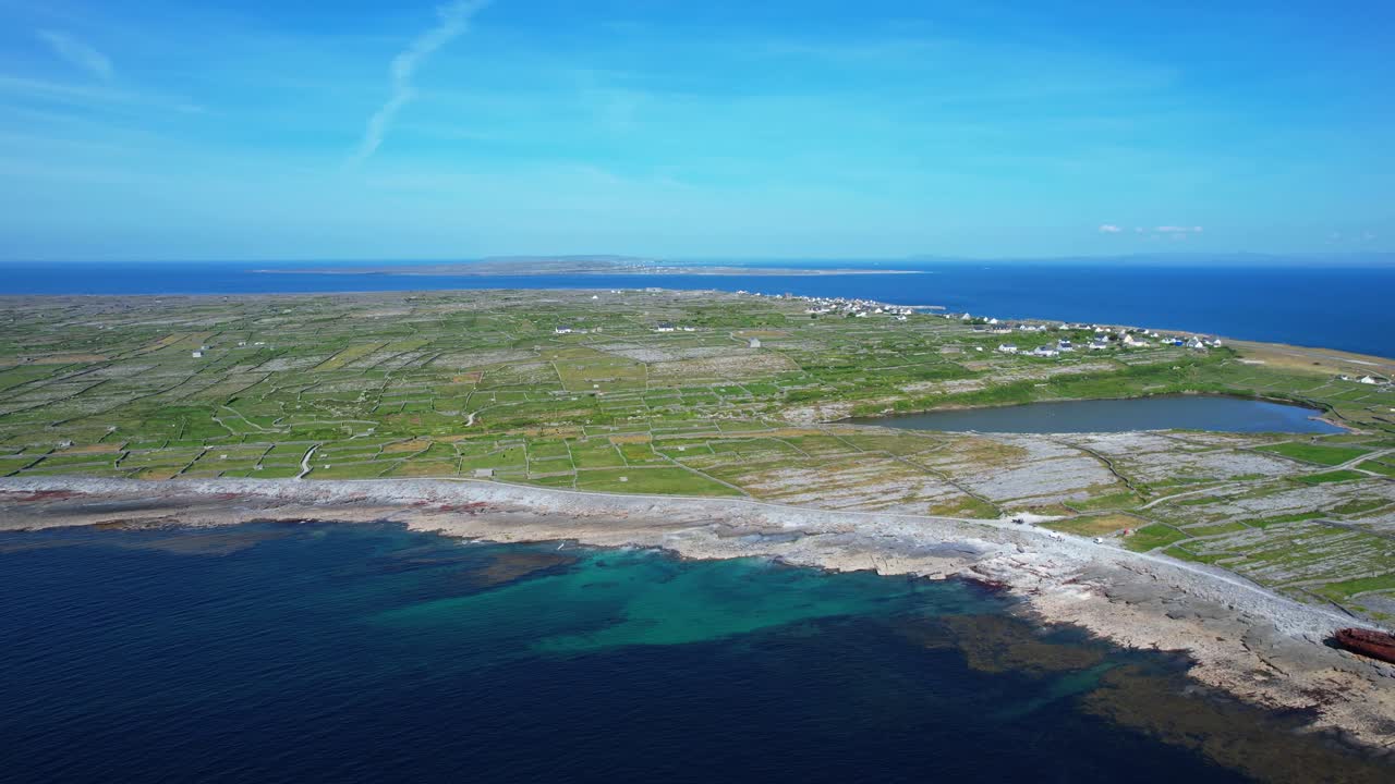 Drone panning shot of Inisheer island aran islands Galway Bay ireland from over the sea Wild Atlantic Way