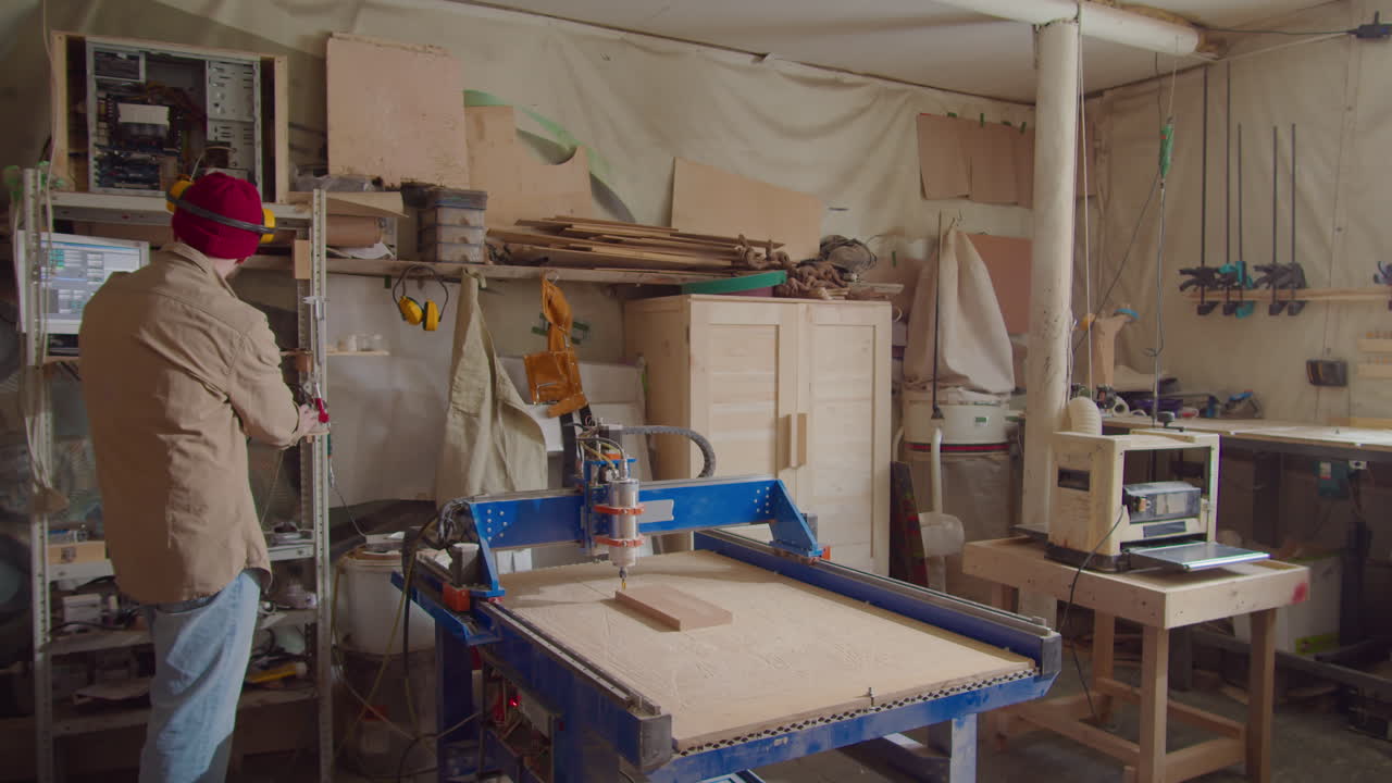 Woodworker Using CNC Machine