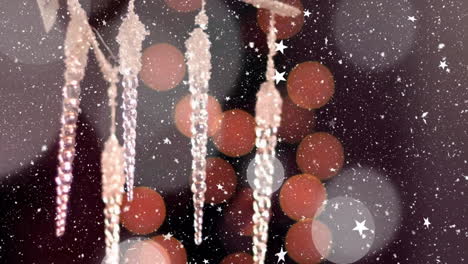 animation of falling snowflakes over christmas decoration and bokeh lights