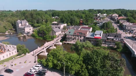 elora ontario slow aerial 19th century downtown on the grand river pull away