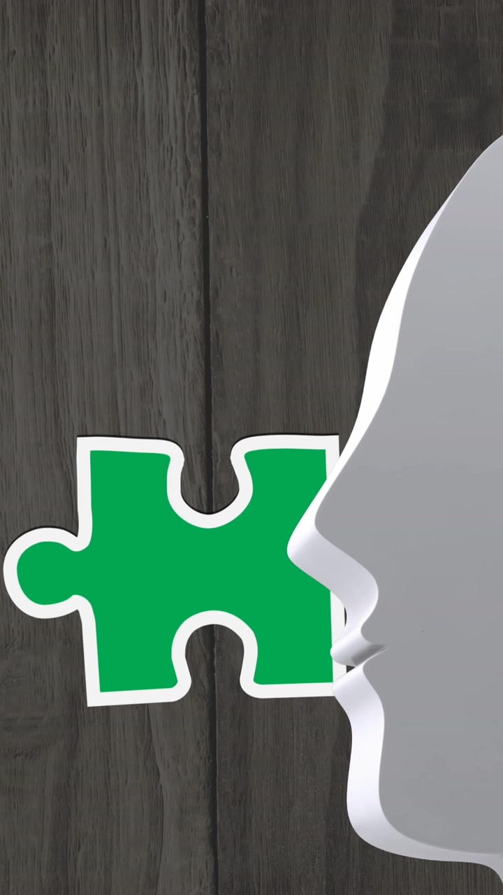 Animation of multi coloured puzzle pieces over wooden background