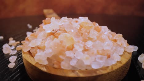 himalayan pink salt in a wooden is used to flavor food. due mainly to marketing costs, pink himalayan salt is up to twenty times more expensive than table or sea salt.