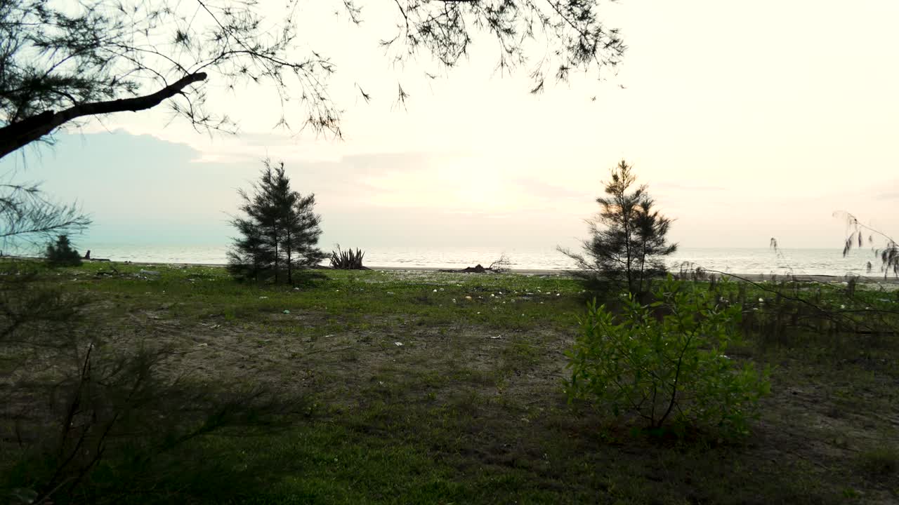 Underated Sunset Gerigat Beach,Fishing Village Kabong.White Sandy Beach,Green Coconut Trees and Blue Sea,Sky Sarawak,Borneo.