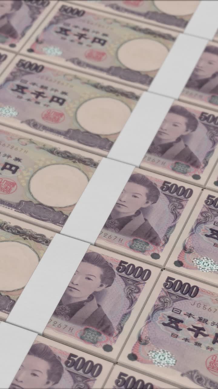 Lodret video af 5000 JAPANSKE YEN pengesedler der trykkes af en pengemaskine