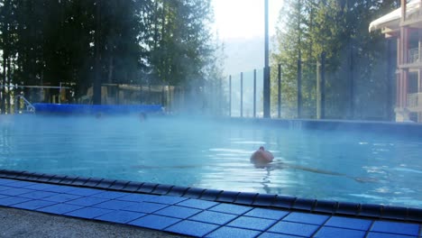 woman relaxing in swimming pool