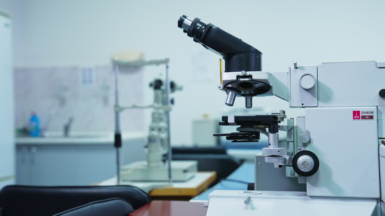 Powerful microscope in research development laboratory. Equipment for different kinds of analysis and tests in present-day hospital. Close up.