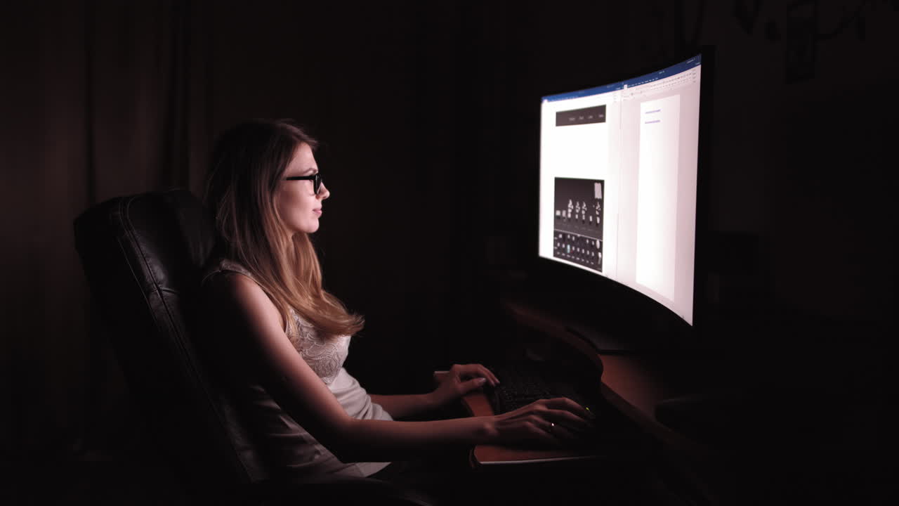 Woman working late at night on computer