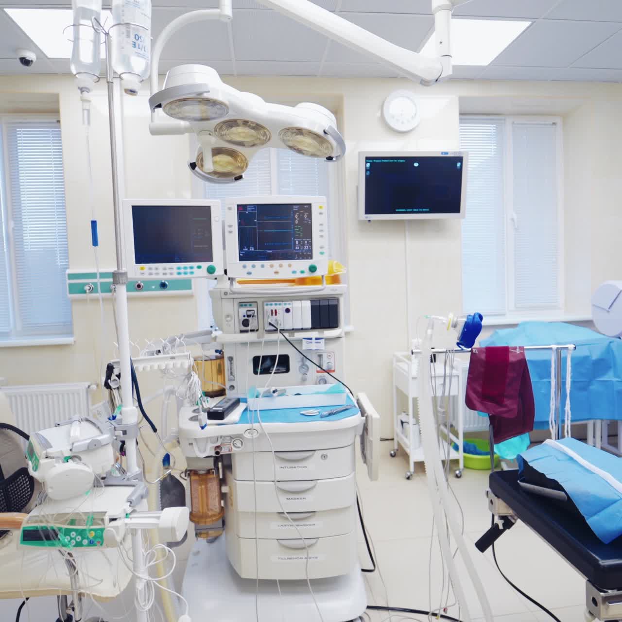 Modern operating room in clinic. Contemporary high-tech equipment in surgery. Da Vinci surgical device. Medical robotic system.