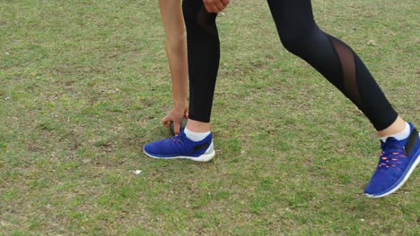 side view of caucasian female athlete holding shot put ball at sport venue 4k