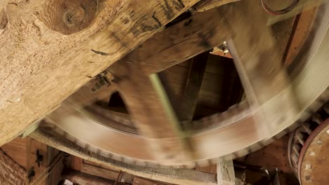 operating wooden sprocket system of an old dutch corn mill