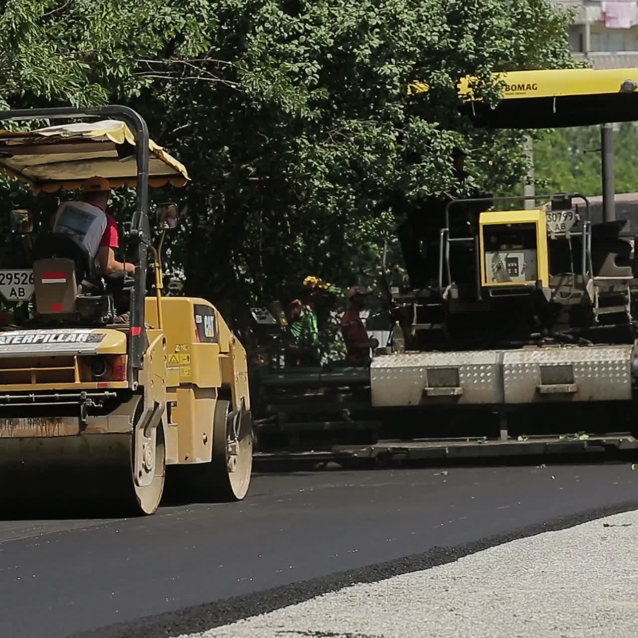 Workers Making Asphalt Road