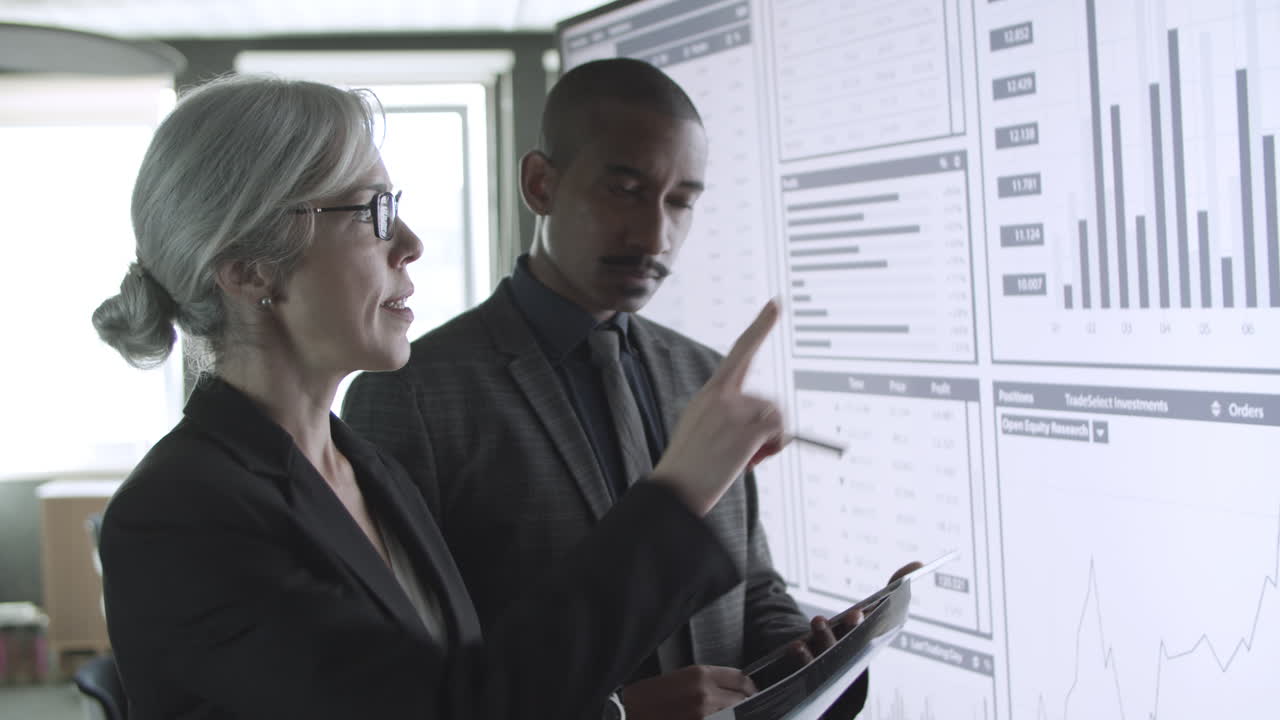 Diverse professionals discussing trading charts